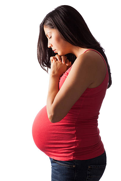schwangere frau beten - praying joy indoors lifestyles stock-fotos und bilder