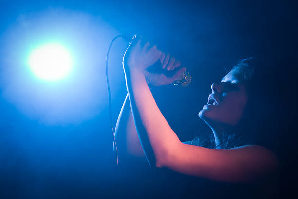 istock Young Female Singer with Microphone 175588480