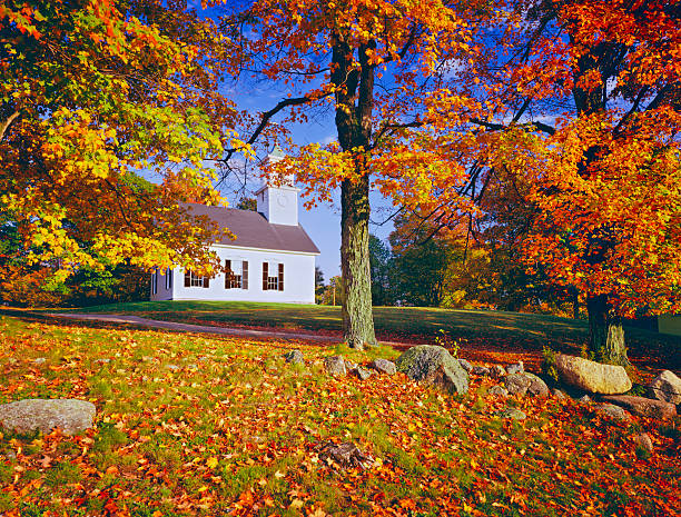 Country church of East Washington New Hampshire surrounded by sugar maples