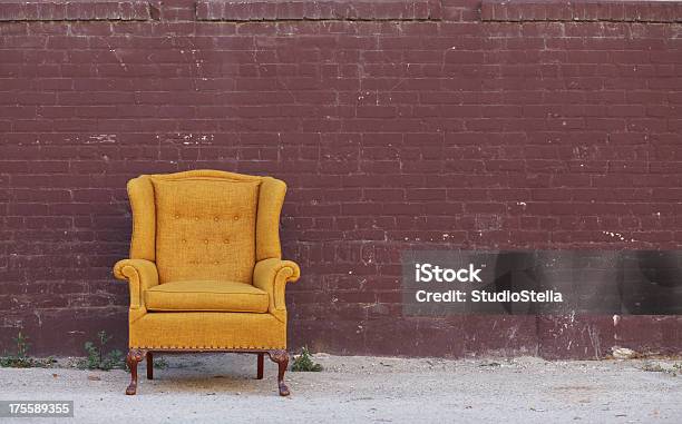 Vintage Wingback Chair Brick Wall Stock Photo - Download Image Now - Chair, Brick, Mural