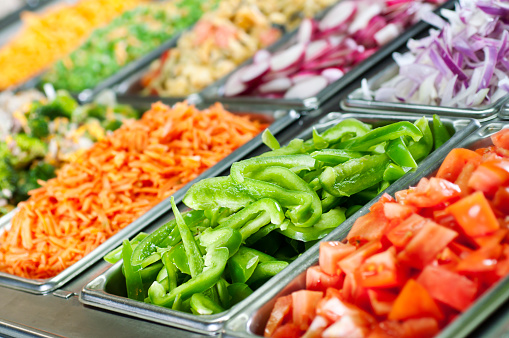 Selective-focus image of a fresh salad bar.