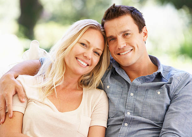 istock Couple Relaxing On Sofa At Home 175590653