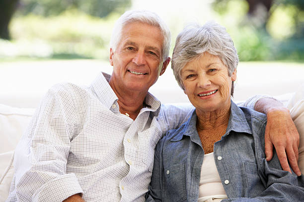 istock Senior Couple Relaxing On Sofa At Home 175590675