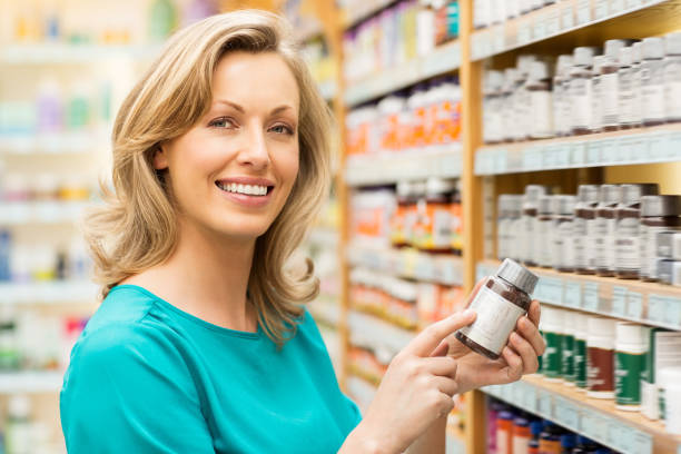 istock Beautiful Woman Holding Pill Bottle 175590698