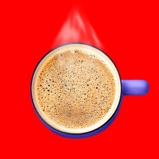 Steaming coffee cup with foam top view red background creative art collage. Hot drink mug flat lay. Energy sip Breakfast