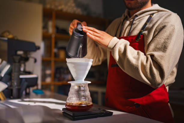 istock Young Barista Brewing Coffee with Chemex 1755911982