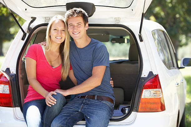 istock Couple Sitting In Trunk Of Car 175591287