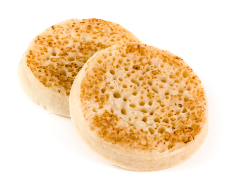 Two crumpets on a white background.