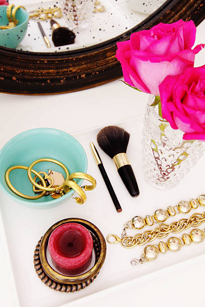 istock Vanity table with jewelry pieces and pink rose on vase 175591689