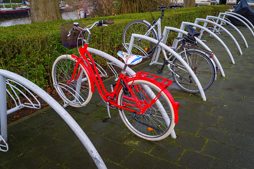 ZWOLLE, NETHERLANDS - MARCH 14, 2021: Remarkable red bicycle parked in a bicycle shed