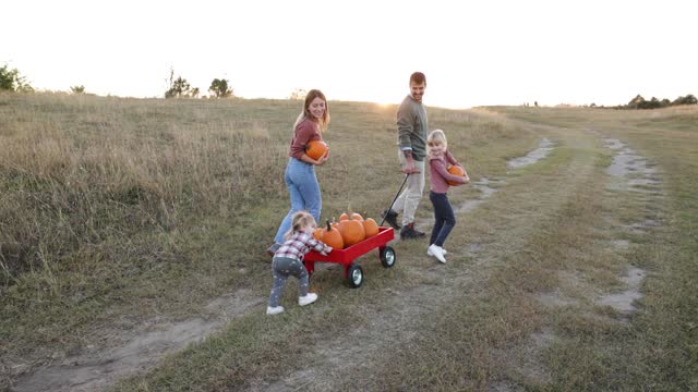 Young family at pumpkin patch