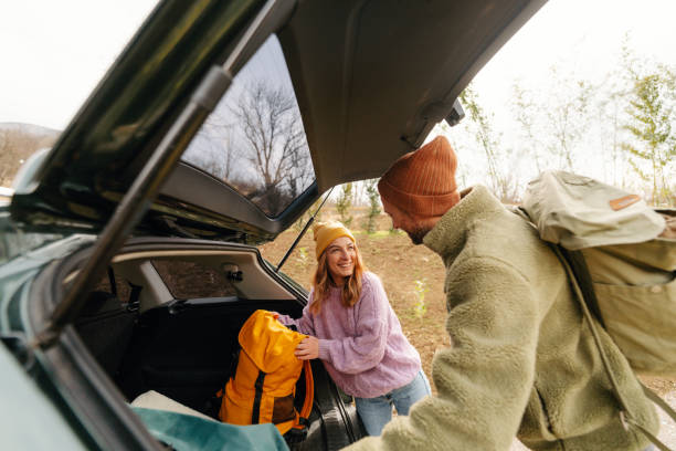 istock Smiling couple on an autumn road trip 1755929464