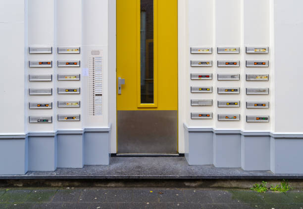 ZWOLLE, NETHERLANDS - MARCH 14, 2021: Lots of doorbells and name plates on an apartment building