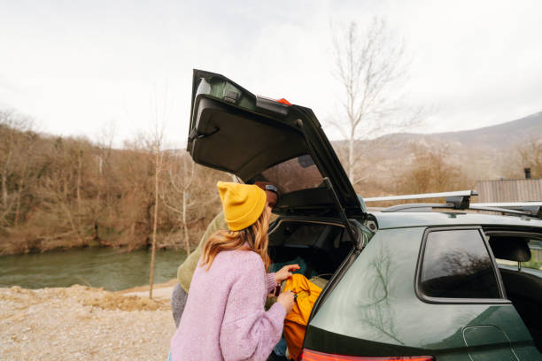 istock Smiling couple on an autumn road trip 1755929993