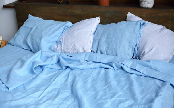 istock pillows on the bed white and blue linen set 1755937841