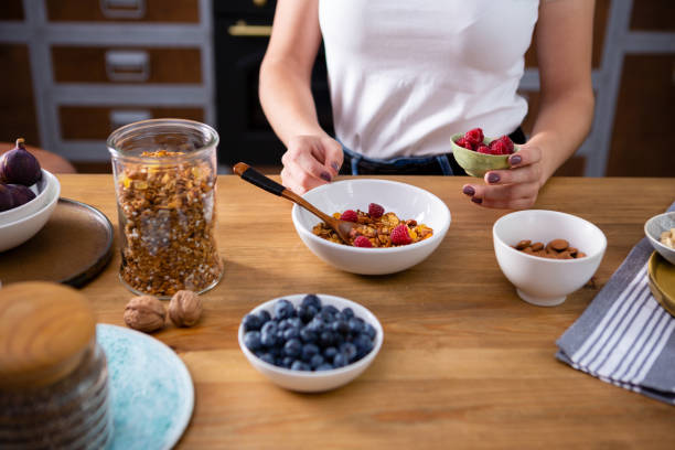 istock Making healthy breakfast concept granola and berry 1755938375