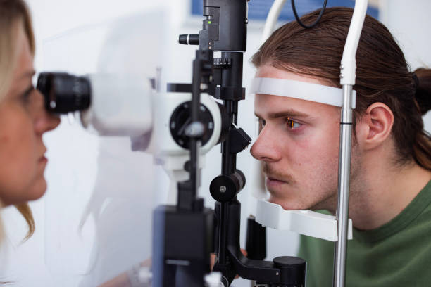 istock Patient getting examined with slit lamp 1755938394