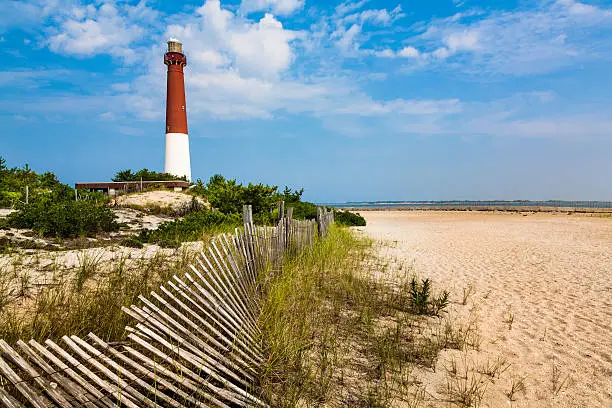Photo of Barnegat Lighthouse, sand, beach, dune fence, New Jersey