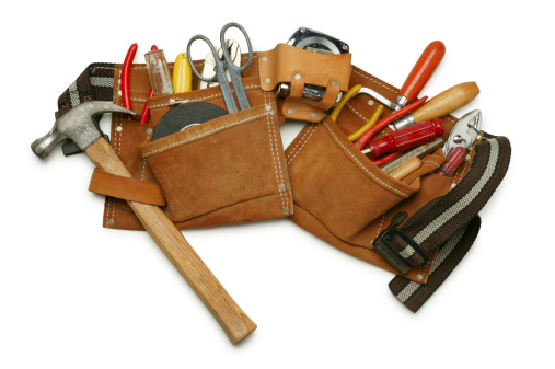 Construction worker's tool belt on white with soft shadow