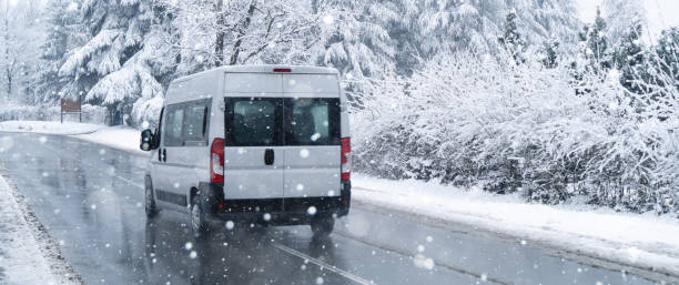 istock Car on a winter road with snow-covered trees 1755942844