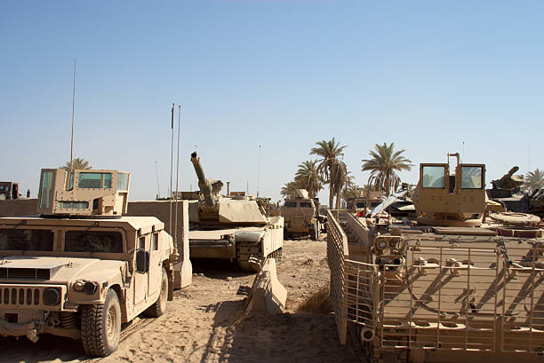 istock Military tanks and vehicles parked at base 175594430
