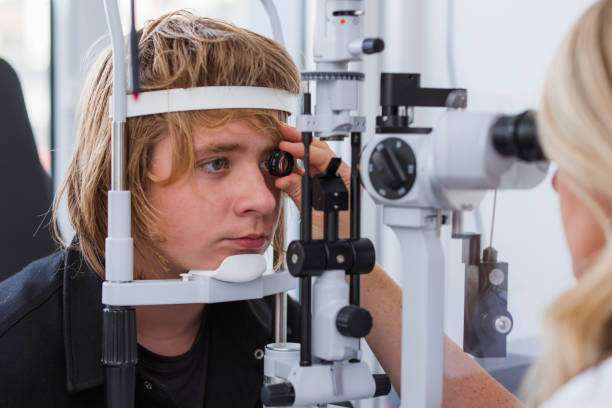 istock Doctor examining patient with slit lamp, close-up 1755953908