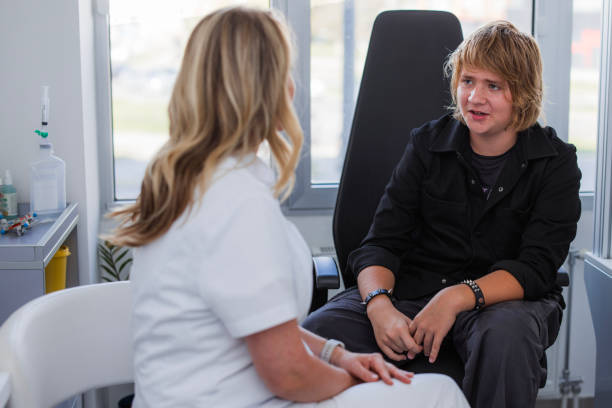 istock Doctor explaining diagnosis to a teenage boy 1755954089
