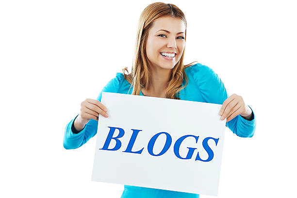istock Cheerful young girl holding BLOGS sign. 175595881
