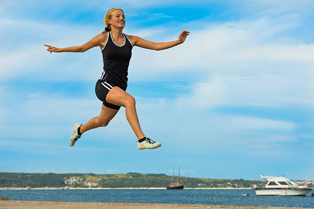 istock Attractive girl jogging by the sea 175596256