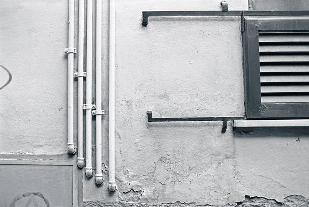 Pipes and rails, photographed outside an Italian house. Scan from Neopan 400 CN