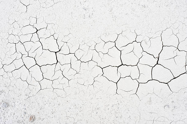 Cracked soil Detail of cracked clay soil texture. dry stock pictures, royalty-free photos & images