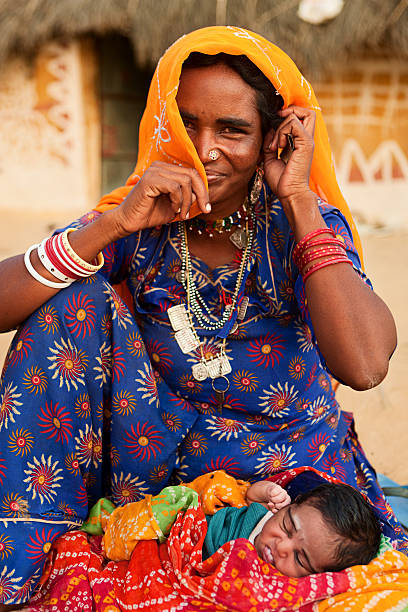 istock Indian woman holding her child 175596827