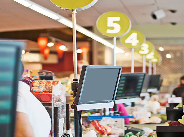 Rows of cashier checkout lanes at a store stock photo