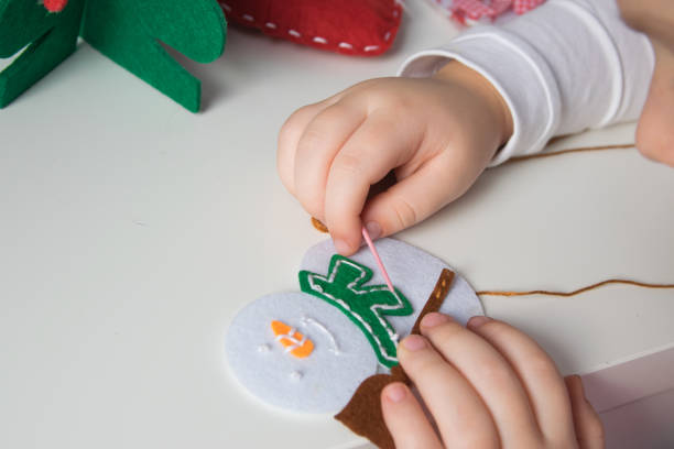 istock Child make snowmans for christmas. 1755969064