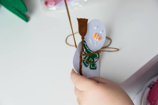 istock Child make snowmans for christmas. 1755969101