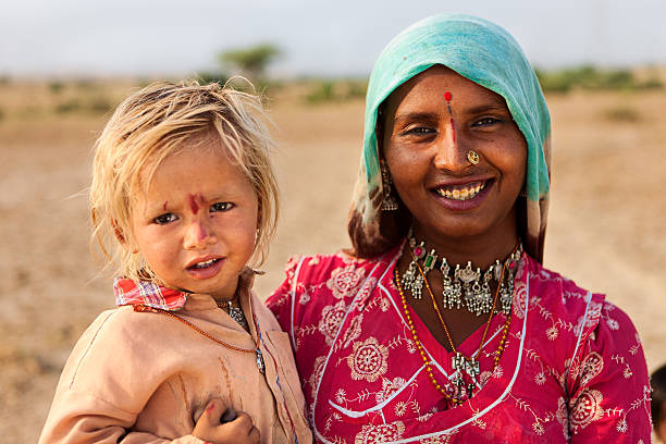 istock Indian woman holding her child 175596929