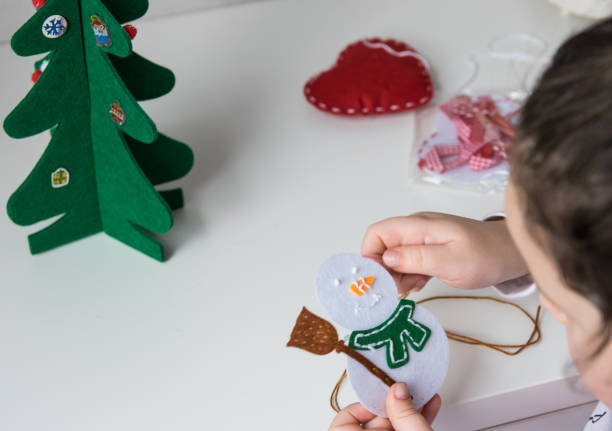 istock Child make snowmans for christmas. 1755969617