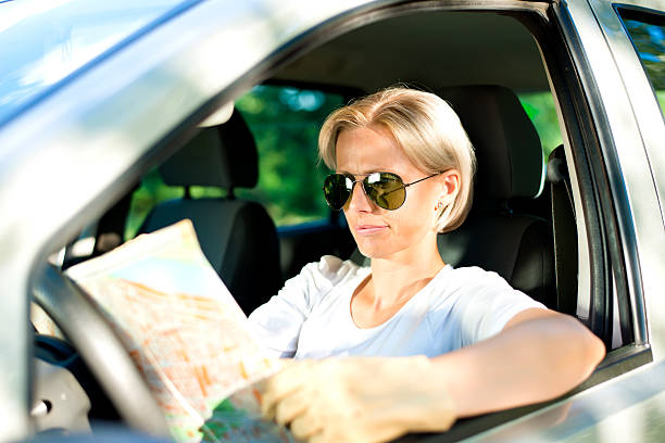 istock Woman Reading Map in the car. 175597556