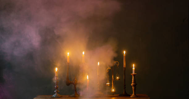 istock burning candles in vintage candlesticks on dark background 1755979850