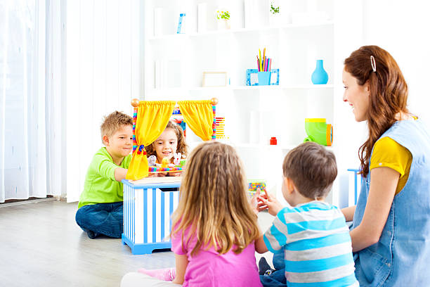 istock Children Playing Finger Puppet Show. 175597990