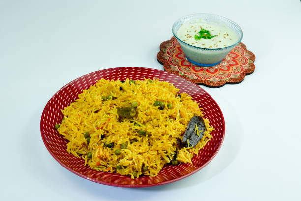 istock Pulao With Peas or Matar Rice and Vegetables Matar Pulao with raita 1755980779