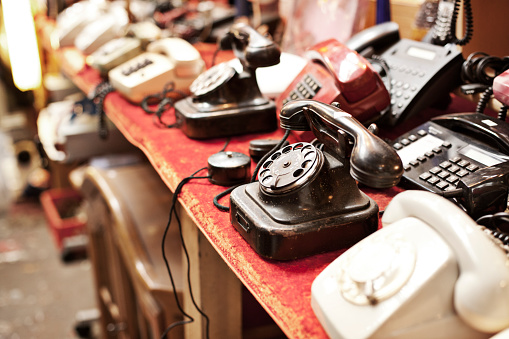Old telephones in a row