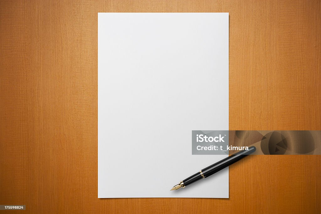 Blank paper on Desk with a pen Blank paper on Desk with a pen. Paper Stock Photo