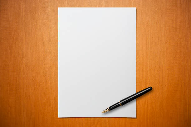 blank paper on desk with a pen - brev dokument bildbanksfoton och bilder