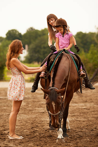 istock Child Riding Horse Outdoors. 175598995