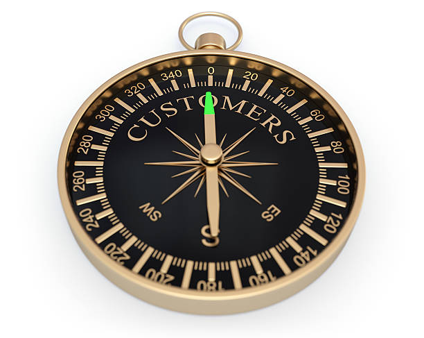 顧客の方向 - compass direction east gold ストックフォトと画像