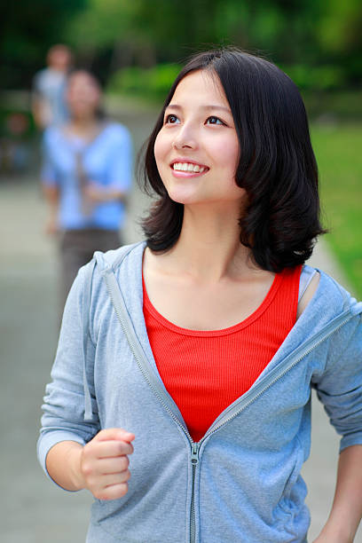 istock young people jogging in the park 175599170