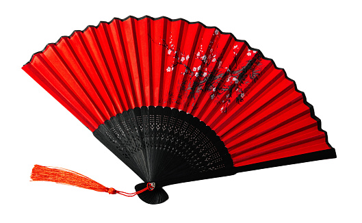 Traditional Japanese red fan, isolated on white or transparent background cutout.