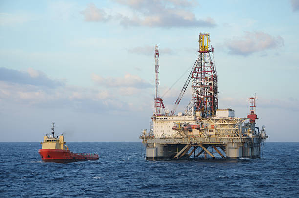 istock Offshore Oil Rig and Supply vessel. 175599284