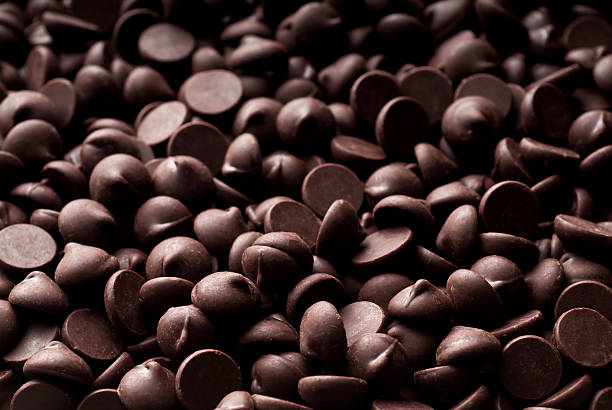 Chocolate Chip Background Chocolate chip background. Please see my portfolio for other food related images. semi sweet chocolate stock pictures, royalty-free photos & images
